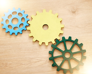 Image showing Settings gear icon, abstract and illustration of cog wheel against a wooden background. Innovation, development and mechanical logo. Setup, engine and symbol for ideas with copy space mockup