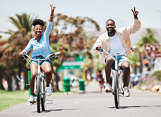 Image showing African couple cycling on bike on vacation, peace hand sign on bicycle for sustainable lifestyle in the city and happy on holiday in summer for travel. Eco friendly man and woman in Miami for spring