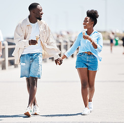 Image showing Couple ice cream, promenade summer walking and love, relax and carefree fun together outdoors. Young black people holding hands, smile partners on a date and happy romantic relationship on sunny day