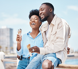 Image showing Happy couple at the beach eating an ice cream cone while on a date in nature while on spring vacation. Black man and woman talking and laughing while hugging and having dessert on holiday by seaside.