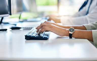 Image showing Hands, keyboard and typing with a business woman working on a computer at her desk in the office. Fingers, email and report with a female employee at work on a desktop pc for compliance or tax