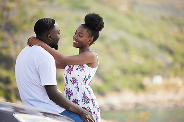 Image showing African couple with smile on road trip with car, travel on summer vacation and happy on drive with transport. Happiness, smile and love man and woman giving hug at the sea during a date in spring