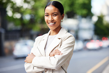 Image showing Business woman working for corporate company in the city, smile for management and happy with leadership at work. Portrait of a professional African employee, worker or manager with arms crossed