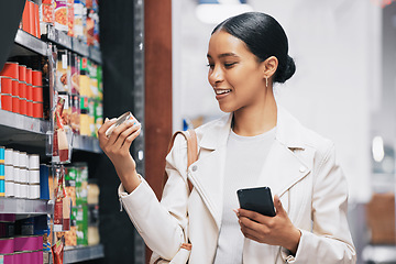 Image showing Supermarket, shopping and customer with smartphone check price, label or product information online. Retail consumer woman with food or grocery checking discount code or sales choice on a digital app