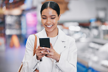 Image showing Happy woman with phone reading funny social media meme on the internet while in a mall. Female with a smile while for discount coupon or texting a contact on a mobile smartphone after retail shopping