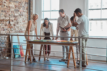 Image showing Art, painting and gallery team meeting and planning an auction, exhibition or showroom opening. Collaboration, teamwork and communication of creative artwork museum workers organizing paintings.