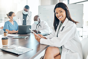 Image showing Healthcare, diversity and black woman doctor with tablet at meeting with team of doctors. Success, communication and collaboration, proud female medical worker and leader in the field of medicine.