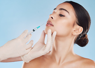 Image showing Plastic surgery, syringe and lip filler on woman for facial beauty aesthetic and medical cosmetic. Hands and female face augmentation surgeon or doctor working on patient lips with injection needle.