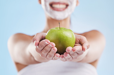 Image showing Wellness, diet and skincare by woman grooming and holding an apple, happy and excited to share her diet. Young female enjoying clean eating and its skin benefits, on a cleanse, weight loss or detox