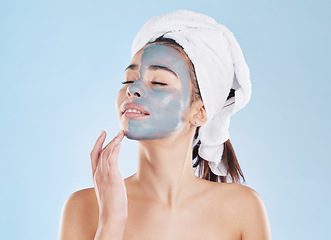 Image showing Charcoal face mask for skincare, cosmetic beauty for health skin and woman care for body against blue mockup studio background. Healthy, young and calm model doing self care with wellness product