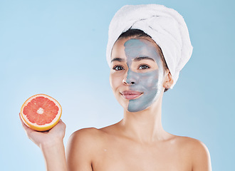 Image showing Woman, skincare and grapefruit face mask, organic beauty and wellness for healthy antiaging, fresh detox and natural clean facial on blue background. Portrait, feminine grooming and model bodycare