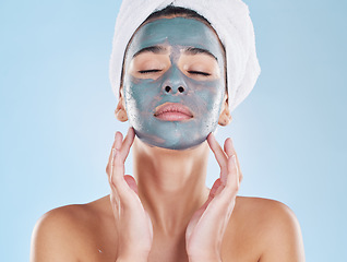 Image showing Skincare, beauty and face mask on a woman while doing her wellness routine in a studio. Latina girl with fresh, body care and hygiene lifestyle doing selfcare facial treatment to relax after a shower