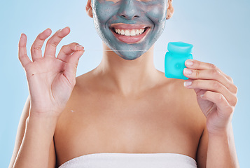 Image showing Teeth, skin and morning self care woman with flossing product, face mask and cleaning teeth for hygiene, wellness and body health. Model with bathroom skincare routine, blue studio background mockup