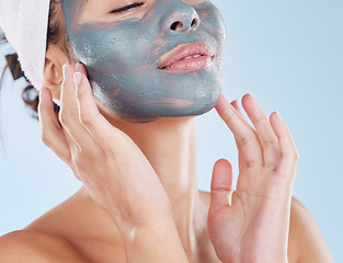 Image showing Skincare, facial and beauty with woman with face mask for cosmetics luxury, relax or acne against blue background studio. Salon, product and dermatology for wellness, spa and treatment