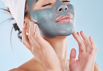 Image showing Charcoal face mask for healthy skincare, wellness of facial skin and beauty product for body care against blue mockup studio background. Mock up of relax, cosmetic and lifestyle model with treatment