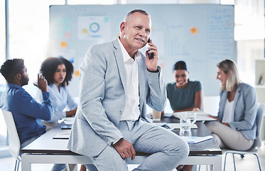 Image showing Leadership, phone call and communication while a ceo sit in a meeting with a team of corporate men and women. Workers in at presentation with senior manager while talking on phone in conference room