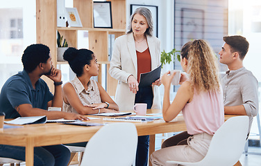 Image showing Ceo woman consulting young team, explain business strategy and professional working together. Group of employees listen to boss, corporate office manager planning meeting and solution focused staff