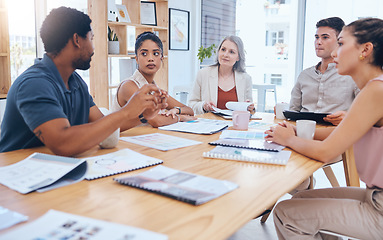 Image showing Teamwork, collaboration and planning with business people in a creative meeting, discuss strategy in a corporate office. Diverse, serious designer united on a goal or mission, sharing idea and vision