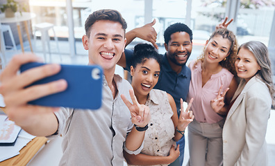 Image showing Diversity work selfie of team with a smile happy about teamwork collaboration and office support. Job friends and digital marketing employee business group posing with a peace hand sign and community