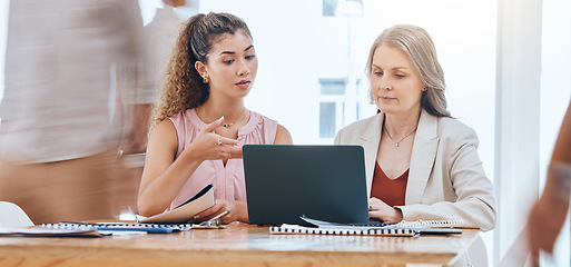 Image showing Teamwork, mentor and coaching with a leader, manager or boss talking to a business woman and working on a laptop at work. Collaboration, learning and planning with a senior supervisor and employee