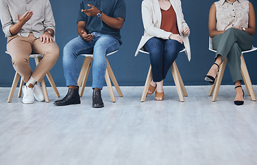 Image showing Interview, human resources and recruitment with business people sitting in line on chairs in a studio or waiting area. Entrepreneur application and hiring for a vacancy at a small startup company