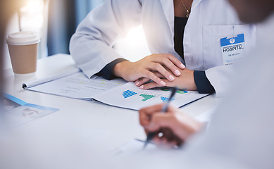 Image showing Doctor planning with report in meeting, healthcare worker and medical expert in discussion about health insurance paperwork and writing hospital schedule in training. Team of nurses in conference