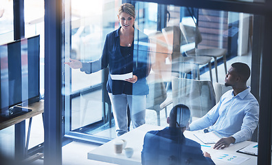 Image showing Presentation, leader and coach talking and pointing at tv screen for marketing and advertising strategy during training workshop. Woman discussing financial growth during briefing with analyst staff