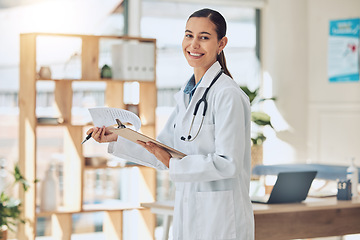 Image showing Doctor, healthcare and consulting with a medical or health professional reading paperwork in the hospital. Trust, insurance and medicine with a woman in a clinic for health, wellness and medicare