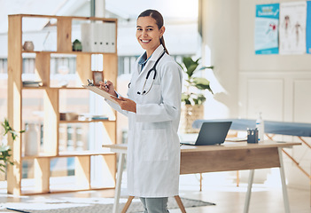 Image showing Doctor in an office with a happy portrait for trust, health care insurance and checklist. Vision, success and smile of healthcare worker woman with clipboard and passion or motivation for her career