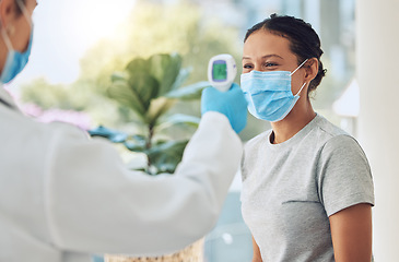 Image showing Covid, mask and doctor thermometer test with patient for virus scan check and consultation. Healthcare worker safety monitor protocol for the prevention of serious illness and hospital care.