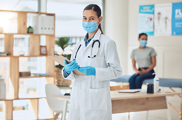 Image showing Doctor, healthcare worker and medical expert doing consultation with patient with covid mask, consulting for health at hospital and giving service at a clinic. Portrait of nurse working in nursing