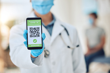 Image showing Covid vaccine barcode on phone, digital passport on screen of smartphone for security and future travel and online certificate for insurance. Hand of doctor with document on web for safety and health