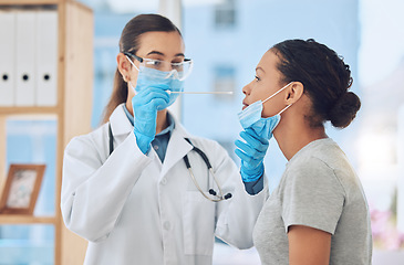 Image showing Medical doctor doing a covid test on patient by taking a sample with nose swab in her office. Healthcare worker and woman with face mask in clinic consultation during coronavirus pandemic in hospital