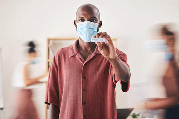 Image showing Covid, rapid antigen test and face mask while standing and showing negative medical results. Portrait of a black man looking happy after coronavirus health screening during pandemic at his workplace