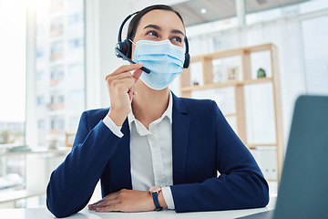 Image showing Covid, telemarketing and customer service consultant with mask at desk while in communication with customer. Corporate help desk woman and worker helping client with crm problem and solution.