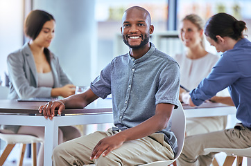 Image showing Portrait of a happy businessman smile in a team planning meeting at work. A proud employee in an office with group as they discuss new innovative plans, idea and strategy in a corporate office