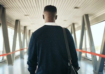 Image showing Travel, vision and black business man taking trip to meeting or global networking seminar, rear view of entrepreneur at the airport. Young professional on mission to upskill and achieve career goals