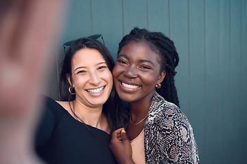Image showing Friends, smile and happy selfie for social media for fashion, street style or trendy clothes women on blue background. Portrait of fun, playing or comic bonding college students for female diversity