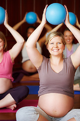 Image showing Pregnant women, pilates class and healthy exercise with multicultural mothers sitting together in a wellness studio. Health, childbirth and pregnancy session for happy women in maternity wear