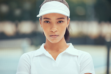 Image showing Tennis, portrait and sports woman with powerful mindset, vision or goal at outdoor court practice, training or match. Young black woman professional player face with fitness mission or game outlook