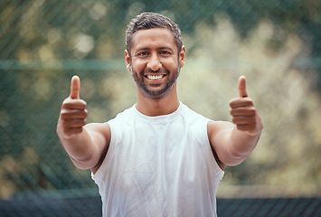 Image showing Happy yes thank you or success thumbs up of a sports man with a smile on a tennis court. Winner, happiness or target goal completion celebration hand gesture of a athlete outdoors with motivation