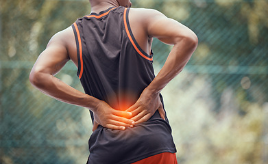Image showing Athletic, fit man with lower back pain, outdoors hold and massages tired and strain muscles or spinal injury. Muscular black man with cramps, inflammation or burning and sore muscle seeking relief.