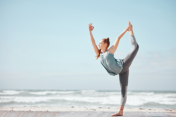 Image showing Health, fitness and yoga with woman meditation pose at a beach, stretching and training workout. Flexible female practice balance, energy and posture in nature, relax with zen and peace mindset
