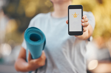 Image showing Smartphone, yoga and software mock up app, advertising or marketing with outdoor green park bokeh. Health fitness woman mat and hand with 5g cellphone mobile, download or website and mediation logo