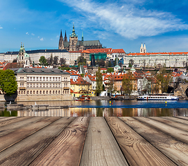 Image showing Wooden planks vith view of Prague Charles bridge over Vltava riv