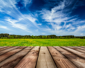 Image showing Wooden planks floor and summer meadow
