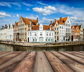 Image showing Wooden planks with Bruges canals in background