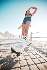 Image showing Girl relax while roller skating, travel or journey on sidewalk for fitness, health and training exercise with flare. Woman on fun city adventure traveling on roller blades for workout bottom view