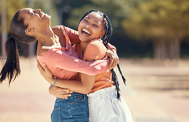 Image showing Happy friends or women hug and laugh together in nature at a park or forest. Smiling, playful sisters embracing, bonding, enjoying a day outdoor and showing affection and appreciation in the woods