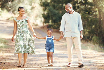 Image showing Black family, love and active parents walking with their child through nature for an adventure and outdoor fun. Happy african man and woman with daughter enjoying travel, vacation and leisure walk